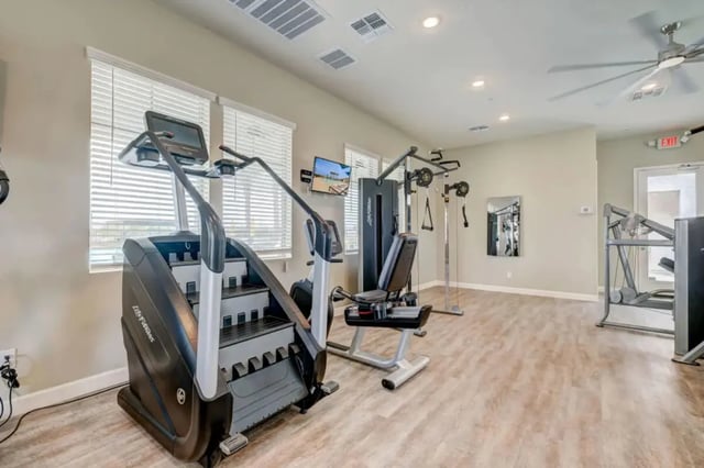 Stair climber recumbent bike weight machine gym area at BB Living at Civic Square in Goodyear Student Accommodation