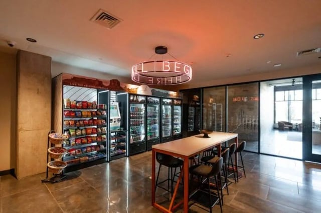 Snack vending area and communal table space living room at Ari on Fourth in Tucson Student Accommodation