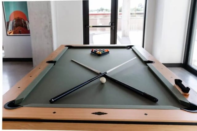 Billiard table with cues balls and rack playing area at Ari on Fourth in Tucson Student Accommodation