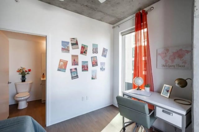Desk with globe and postcards study area at Ari on Fourth in Tucson Student Accommodation