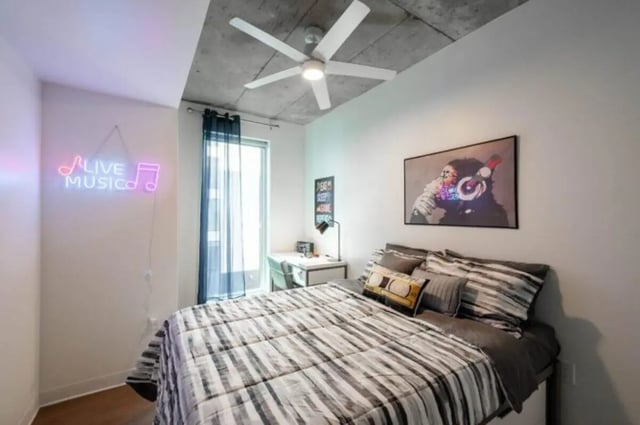 Bed with music art desk and neon Bedroom at Ari on Fourth in Tucson Student Accommodation
