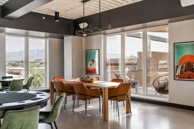 Dining table with chairs and game table living room at Ari on Fourth in Tucson Student Accommodation