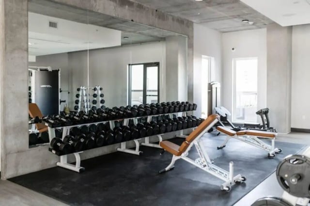 Dumbbells benches and weight racks gym at Ari on Fourth in Tucson Student Accommodation