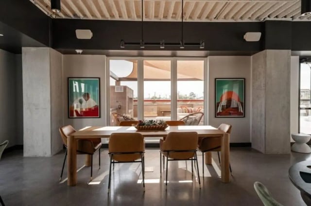Wooden table with chairs paintings and view dining area at Ari on Fourth in Tucson Student Accommodation