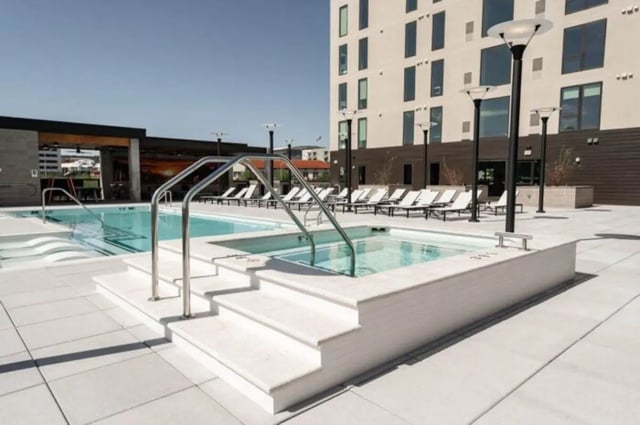 Pool and hot tub with lounge chairs exterior at Ari on Fourth in Tucson Student Accommodation