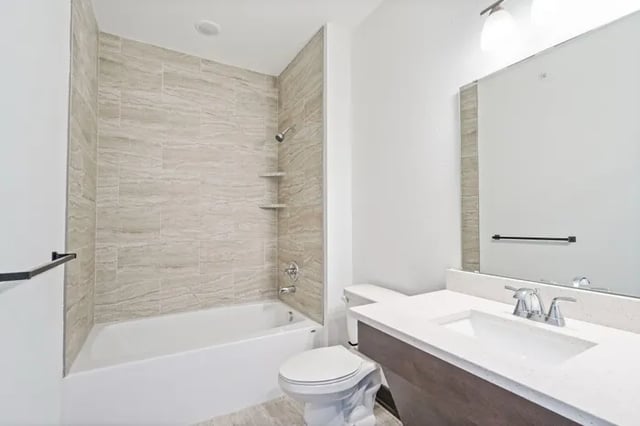 Bathtub toilet and vanity sink bathroom at Parkville Flats in Parkville Student Accommodation