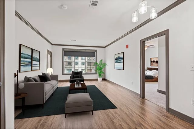 Modern living room with sofa and armchair living room at Parkville Flats in Parkville Student Accommodation