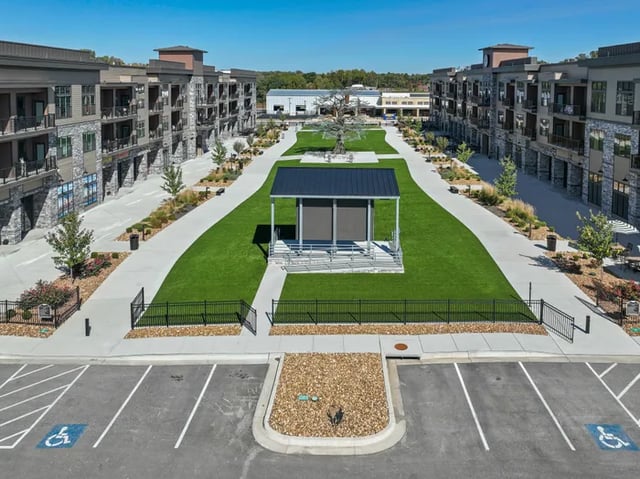 Apartment buildings with courtyard and pavilion exterior at Parkville Flats in Parkville Student Accommodation