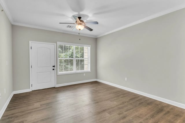 Empty room with door window and ceiling fan living room at Woodhaven Apartment Living in Kansas City Student Accommodation
