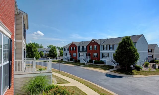 Townhouses with brick and siding exteriors exterior at Canvas Townhomes in Allendale Student Accommodation