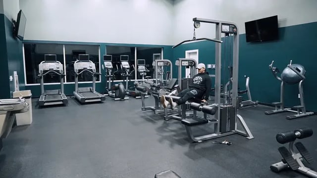 Gym with treadmills and weight machines gym at Canvas Townhomes in Allendale Student Accommodation