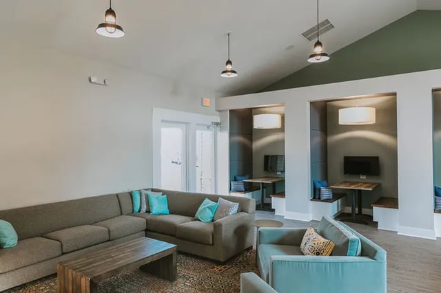 Sofa tables and study booths living room at Canvas Townhomes in Allendale Student Accommodation