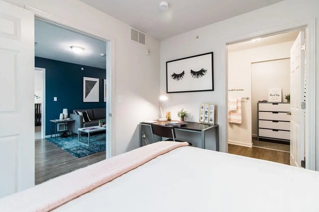 Desk with lamp and artwork with adjoining bathroom bedroom at Locale Student Housing in Allendale Student Accommodation