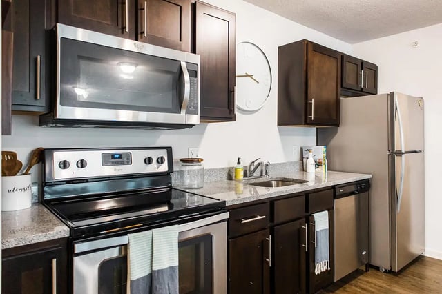 Stove microwave dishwasher refrigerator kitchen at Locale Student Housing in Allendale Student Accommodation