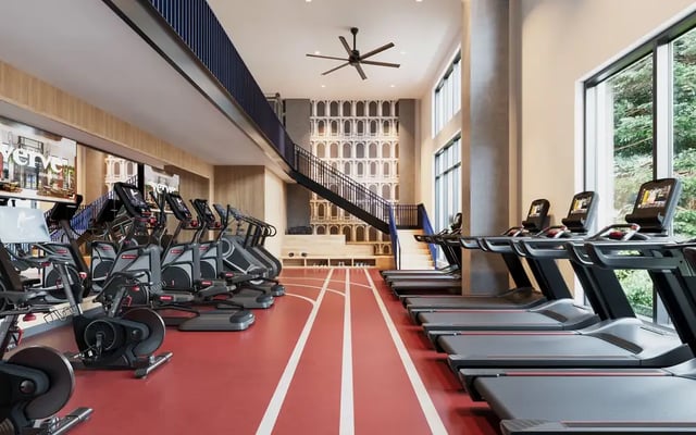 Treadmills and ellipticals in a gym. at VERVE Ann Arbor in Ann Arbor Student Accommodation