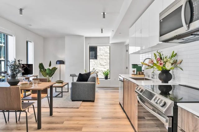 Dining table couch plants television kitchen living area at Ace Berkeley in Berkeley Student Accommodation