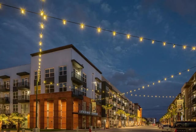 Modern apartments with string lights exterior at The Flats at Big Tex in San Antonio Student Accommodation