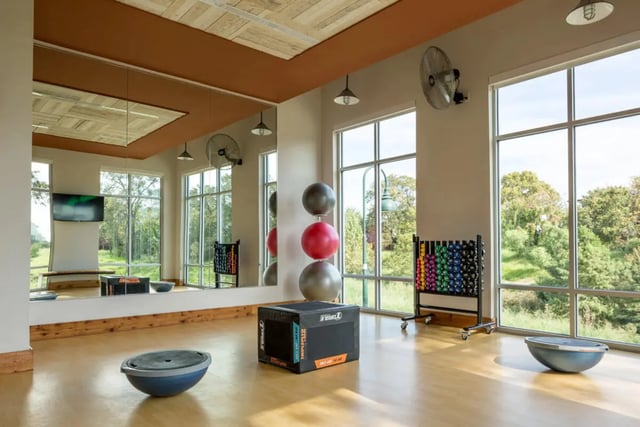 Gym with bosu balls weights and fans at The Flats at Big Tex in San Antonio Student Accommodation