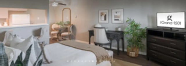 Bed desk chairs dining table television bedroom at The Grand 1501 in College Station Student Accommodation