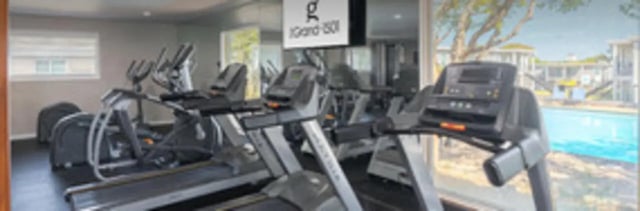 Treadmills elliptical gym equipment fitness room at The Grand 1501 in College Station Student Accommodation