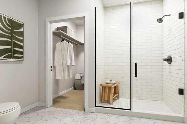 Toilet closet with robes and tiled shower area bathroom at The Mercury in Austin Student Accommodation