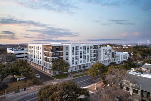 Modern apartment building with balconies and street view exterior at The Mercury in Austin Student Accommodation