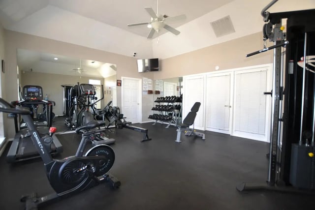 Treadmills ellipticals rowing machines weights gym playing area at The Oaks of Arlington in Arlington Student Accommodation