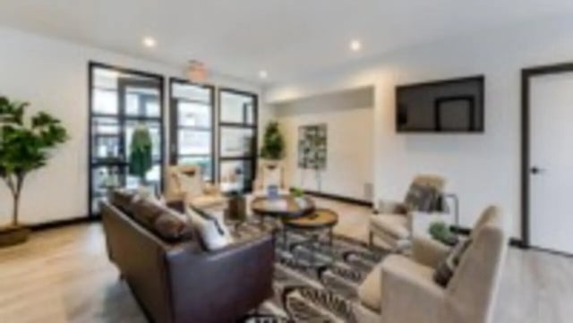 Modern living room with couches coffee table living room at Victory at Burcham Place in East Lansing Student Accommodation