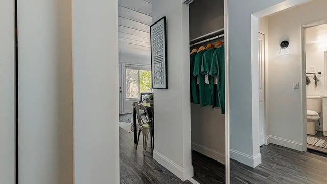 Green shirts in closet dining area and bathroom at Victory at Burcham Place in East Lansing Student Accommodation