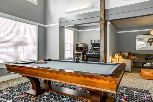 Pool table arcade games sofa common area at The Nest at 4955 in Wilmington Student Accommodation
