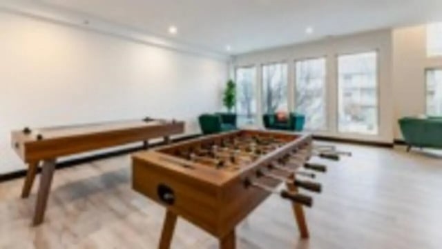 Foosball table and shuffleboard table recreation area at Victory on Abbot in East Lansing Student Accommodation
