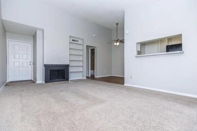 Door fireplace shelves fan open kitchen living room at Villas at Alameda in Fort Worth Student Accommodation