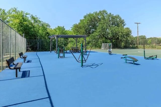 Exercise equipment benches and a soccer goal playing area. at Villas at Alameda in Fort Worth Student Accommodation