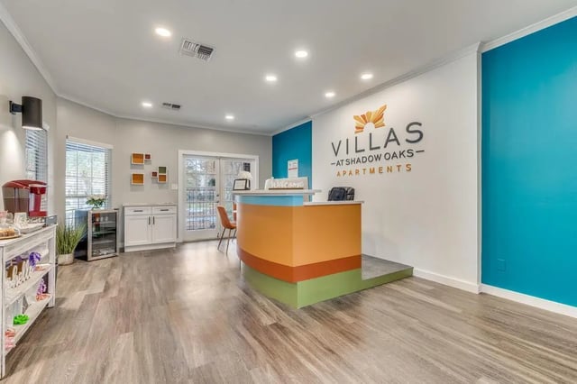 Welcome desk with coffee maker and mini fridge reception at Villas at Shadow Oaks in Austin Student Accommodation