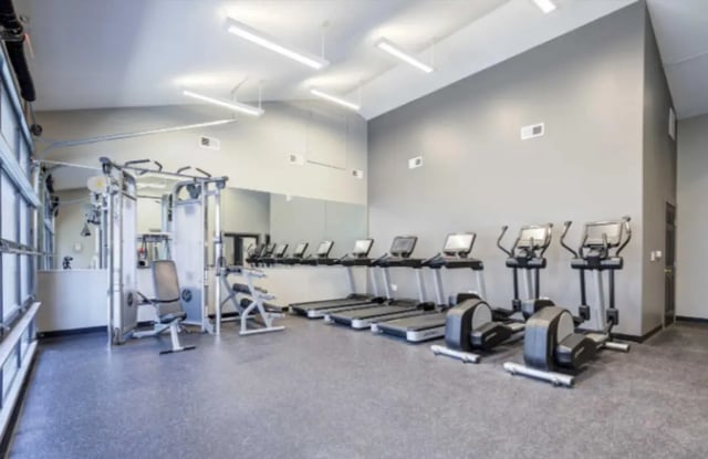 Gym equipment with treadmills and elliptical machines gym at Collegiate Suites of Blacksburg in Blacksburg Student Accommodation