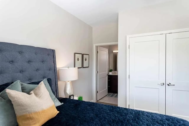 Tufted headboard lamp two framed pictures bedroom at Avoca in Louisville Student Accommodation