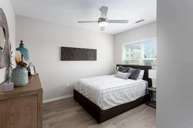 Bed with grey pillows and dresser bedroom at Avoca in Louisville Student Accommodation