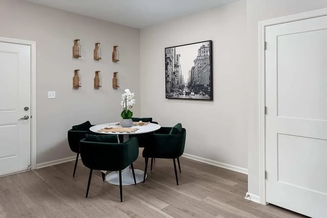 Round table with chairs and wall decor dining area at Avoca in Louisville Student Accommodation