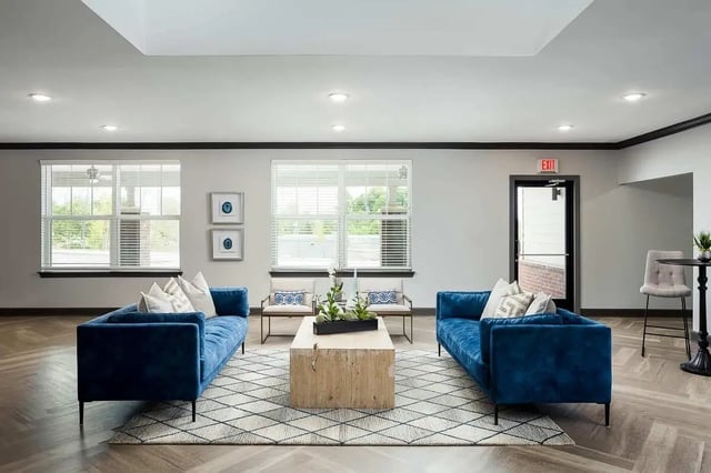 Two blue sofas and coffee table living room at Avoca in Louisville Student Accommodation