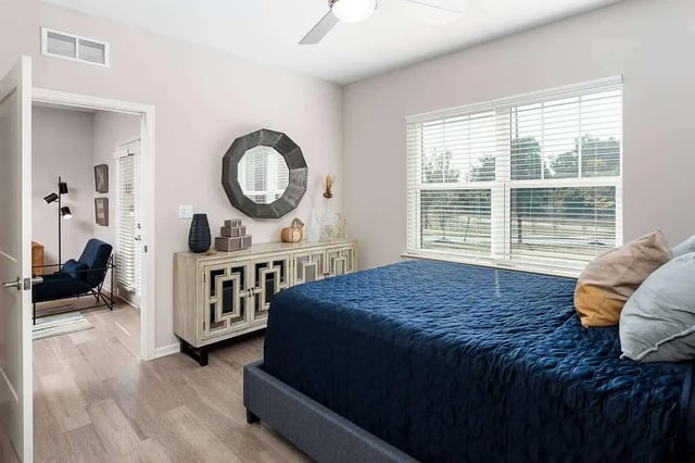 Blue bed dresser mirror and armchair bedroom at Avoca in Louisville Student Accommodation