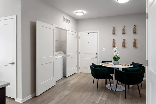 Washer dryer and dining set dining area at Avoca in Louisville Student Accommodation
