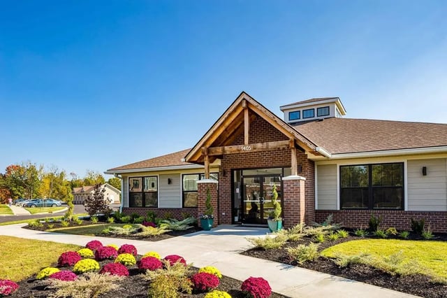 Entrance with colorful flowers and landscaping exterior at Avoca in Louisville Student Accommodation
