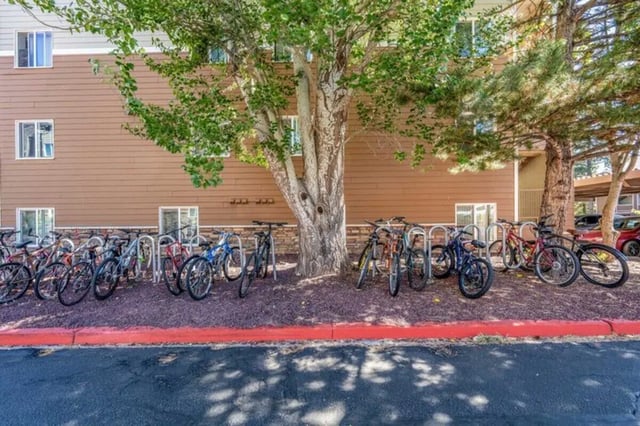 Bicycles parked outside student housing building exterior at The Commons at Sawmill in Flagstaff Student Accommodation
