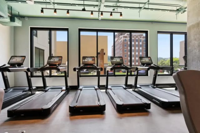 Row of treadmills with screens fitness area at Steelhaven Birmingham in Birmingham Student Accommodation