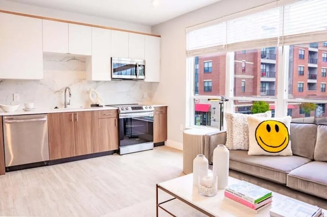 Modern kitchen and living area with sofa living room at 8th and High Columbus in Columbus Student Accommodation