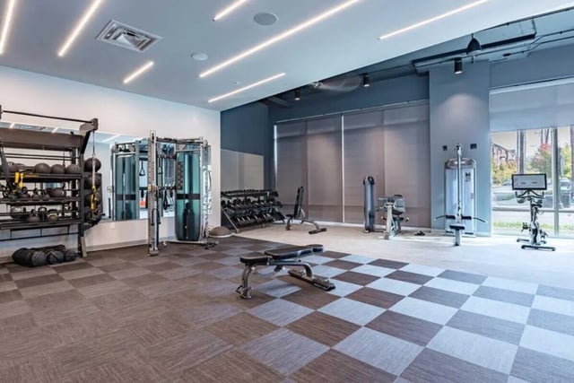 Gym equipment weights benches and machines Fitness room at 8th and High Columbus in Columbus Student Accommodation