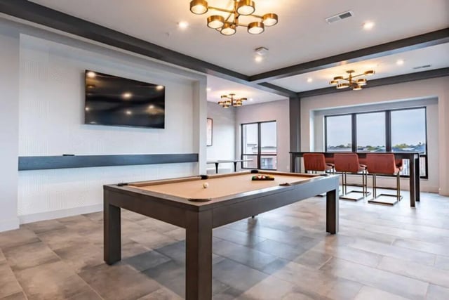 Pool table television bar area living room at 8th and High Columbus in Columbus Student Accommodation
