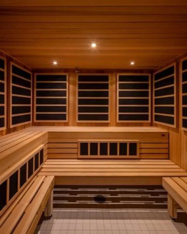 Wooden benches with black panels spa area at Proxi Lawrence in Lawrence Student Accommodation