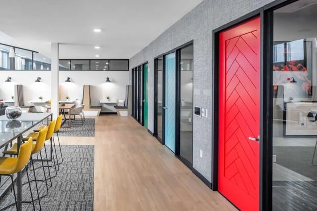 Colorful doors and seating areas study area at Proxi Lawrence in Lawrence Student Accommodation