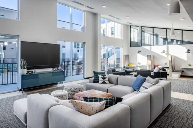 Sofa television cabinet poufs living room at Proxi Lawrence in Lawrence Student Accommodation